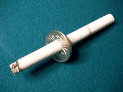cigarette through coin